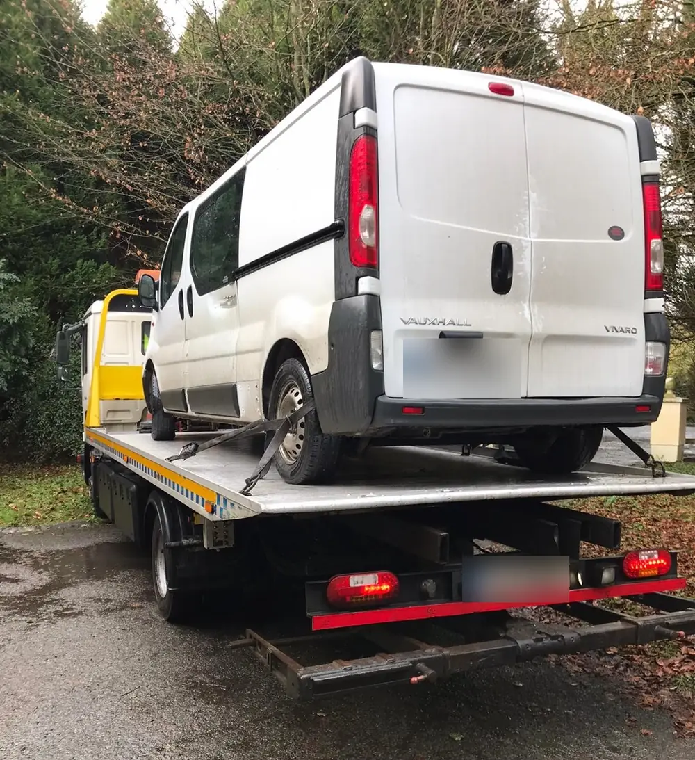 Van recovery: a white panel van loaded and strapped